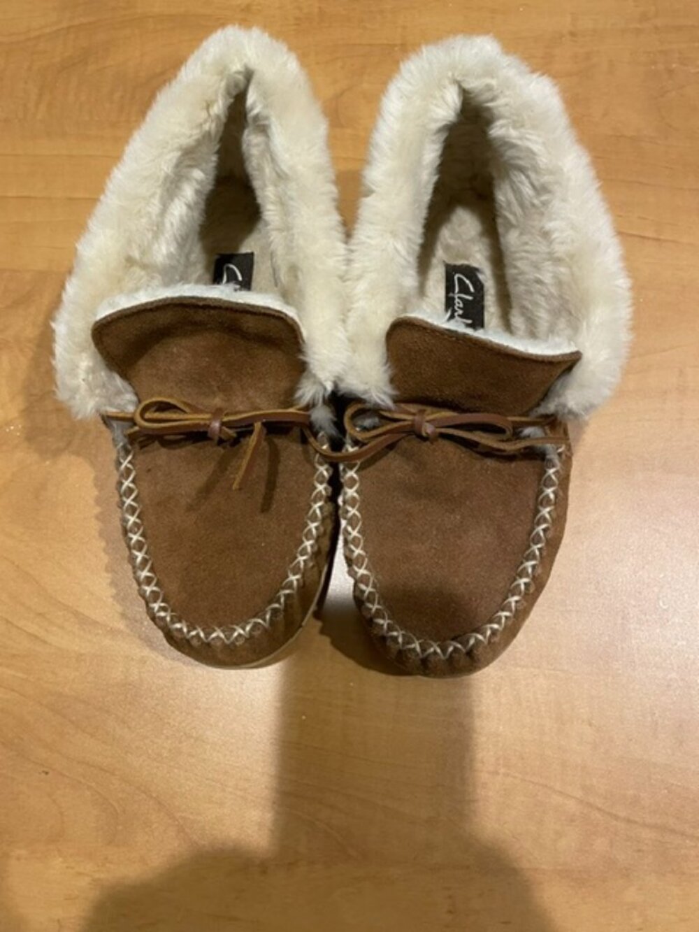 Women's Clarks Moccasin style cozy slippers in dark honey color